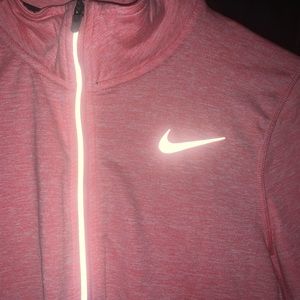 Nike Dri Fit quarter-zip. Size XS. Peachy pink color. Reflective details